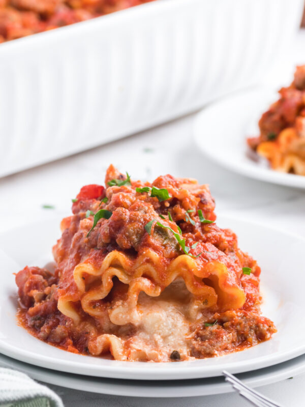 one Italian Sausage Lasagna Roll Ups on a plate