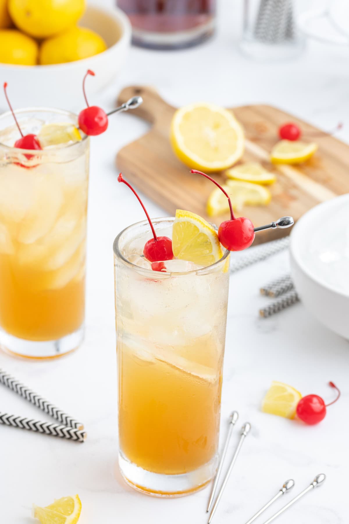 whiskey sour punch served in tall glasses