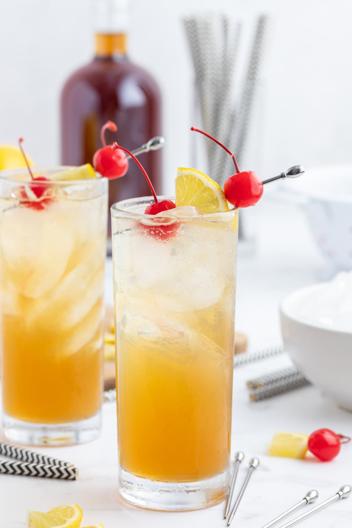 two tall glasses of whiskey sour punch